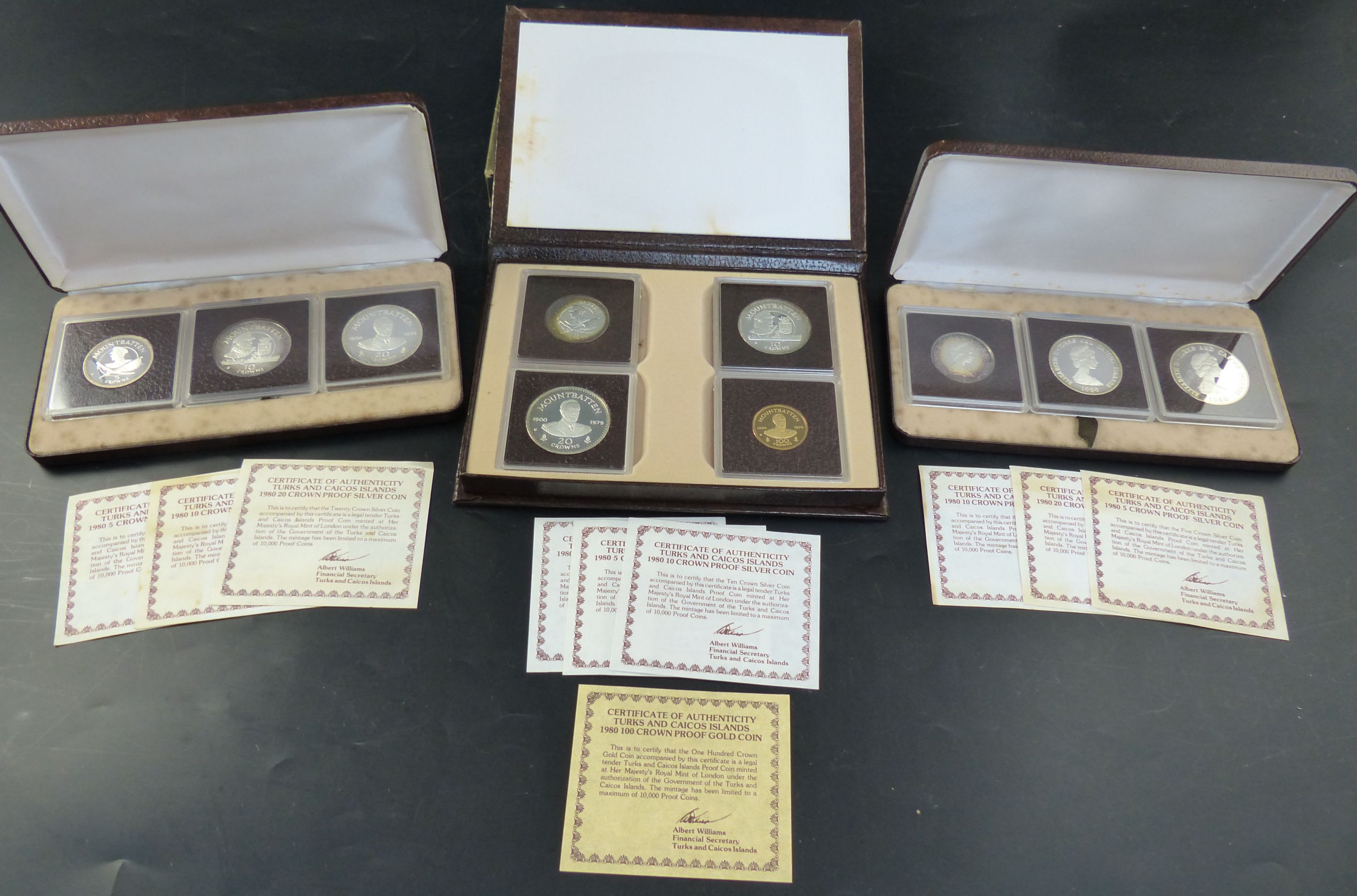 Three Turks and Caicos Islands proof coin sets, 1980 set of four 100 crown proof gold coin with 2010 and five crowns in silver;